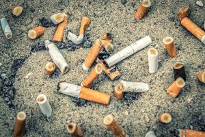 Cigarette butts in sand